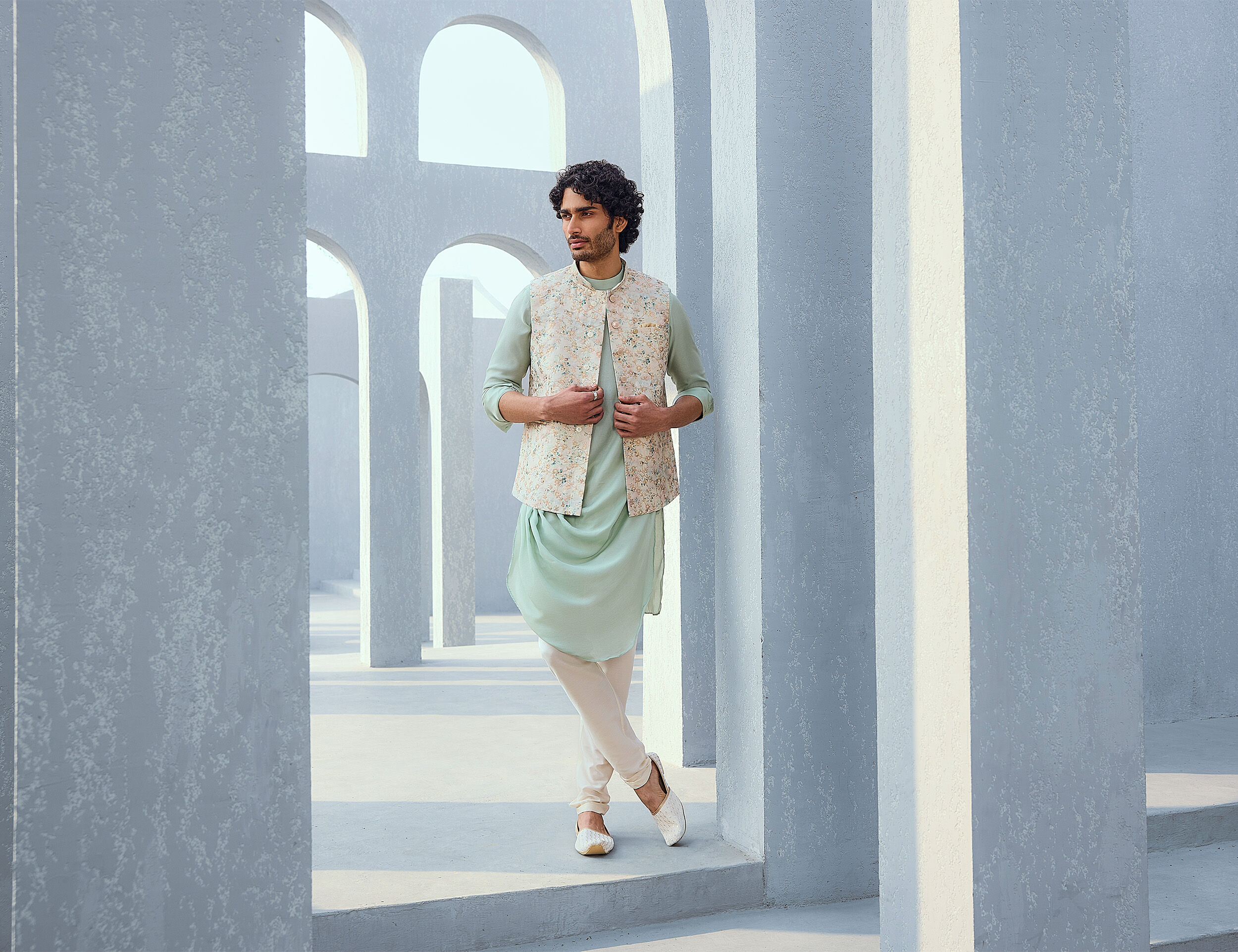 men in white cream colour nehru jacket on bluue kurta pajama